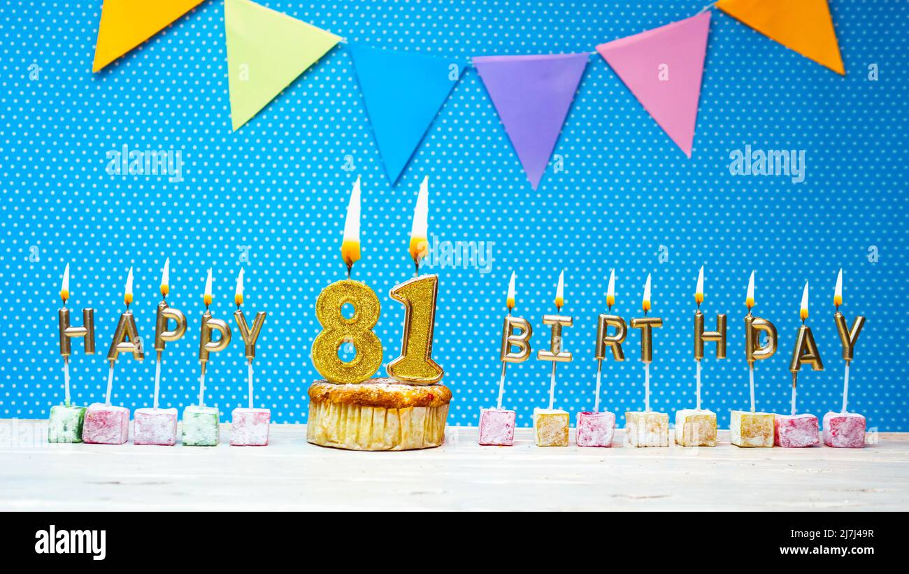 Happy birthday from candle letters on a blue background with white