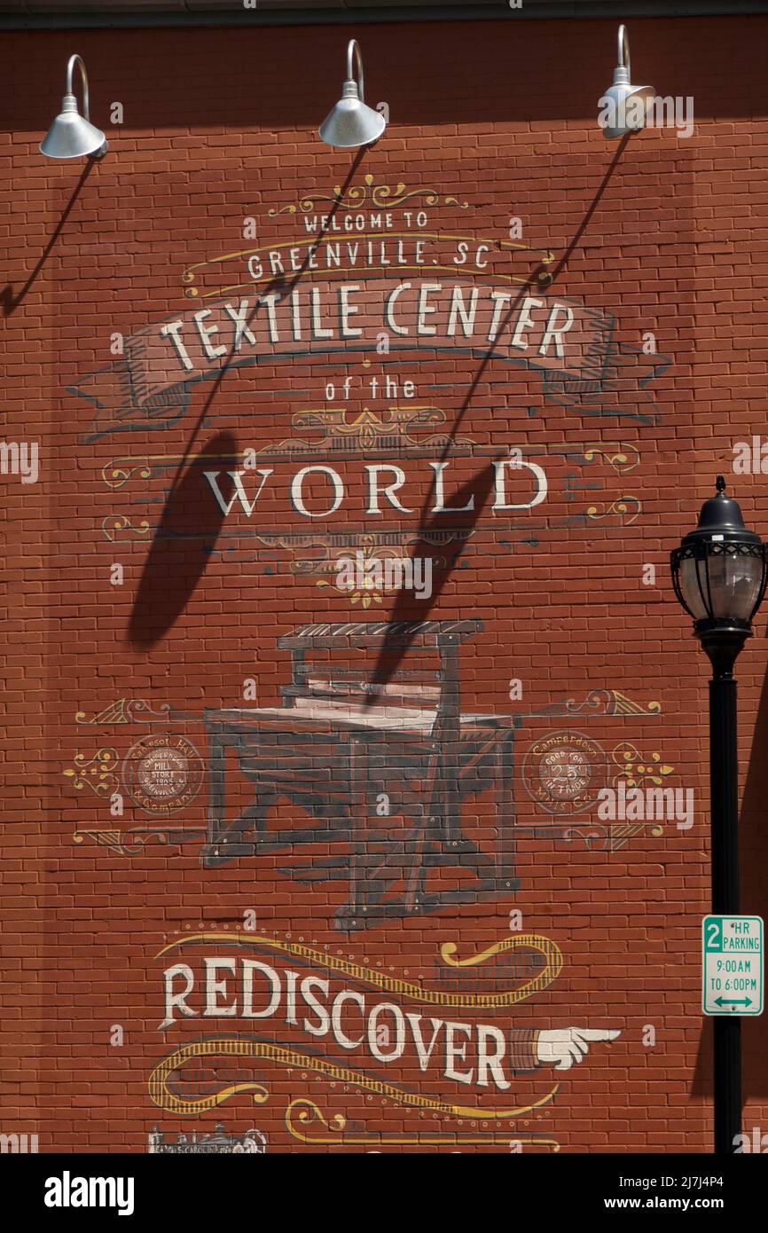 old Textile center of the world vintage advertisement on the side of a building in Greenville SC Stock Photo