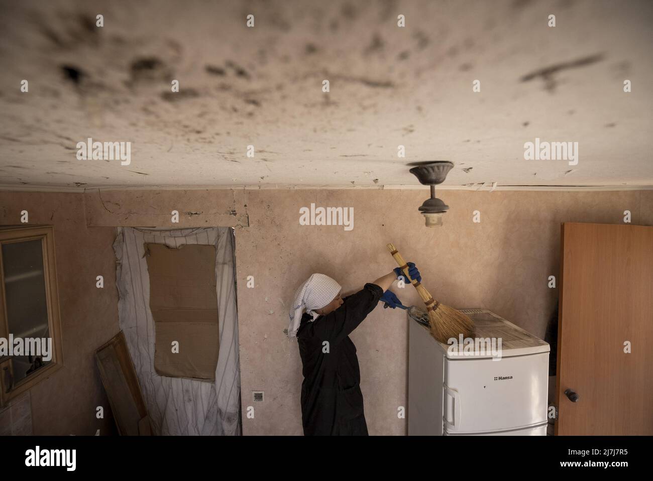 Irpin, Ukraine. 09th May, 2022. Svetlana Magyrovks, 58, cleans her kitchen after Russians shelled the neighborhood in early March in Irpin, Ukraine, Monday, May 09, 2022. President Joe Biden on Monday signed new a new 'lend-lease' military and economic aid package for Ukraine after the measure was passed overwhelmingly by Congress last month. Photo by Ken Cedeno/UPI Credit: UPI/Alamy Live News Stock Photo