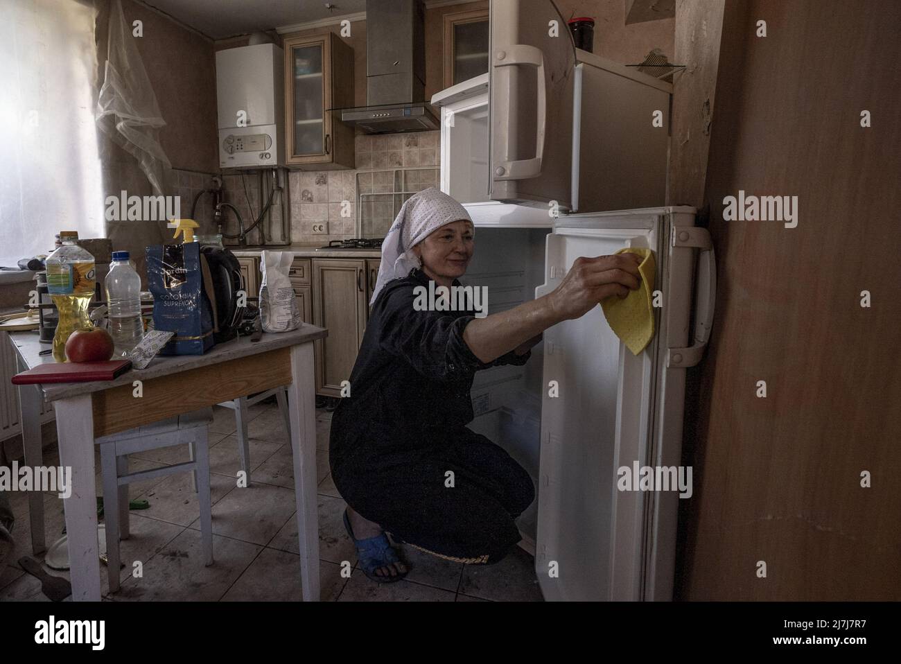 Irpin, Ukraine. 09th May, 2022. Svetlana Magyrovks, 58, cleans her kitchen after Russians shelled the neighborhood in early March in Irpin, Ukraine, Monday, May 09, 2022. President Joe Biden on Monday signed new a new 'lend-lease' military and economic aid package for Ukraine after the measure was passed overwhelmingly by Congress last month. Photo by Ken Cedeno/UPI Credit: UPI/Alamy Live News Stock Photo