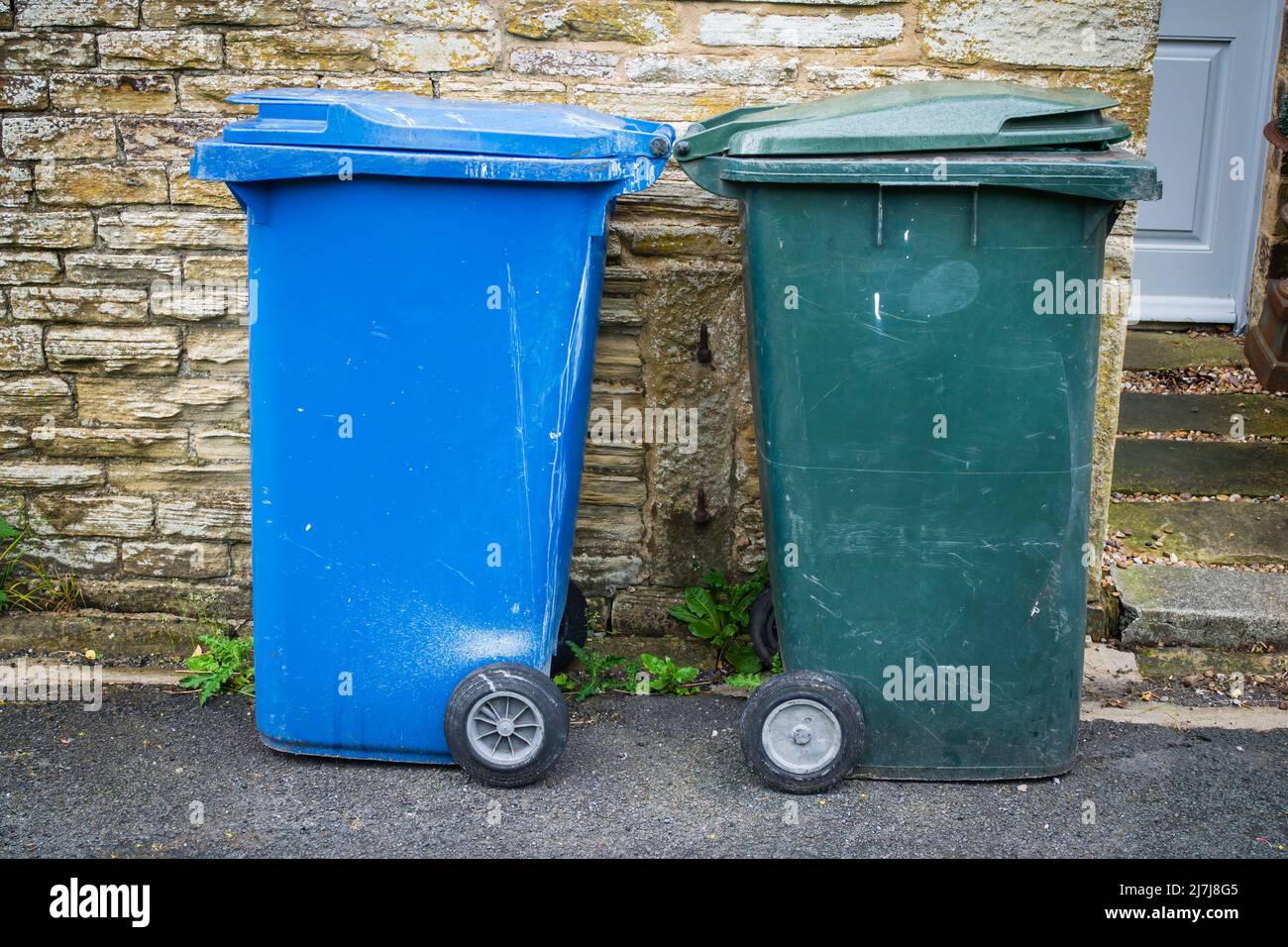 06.05.2022 Settle, North Yorkshire, Uk Two wheelie bins, one blue and ...