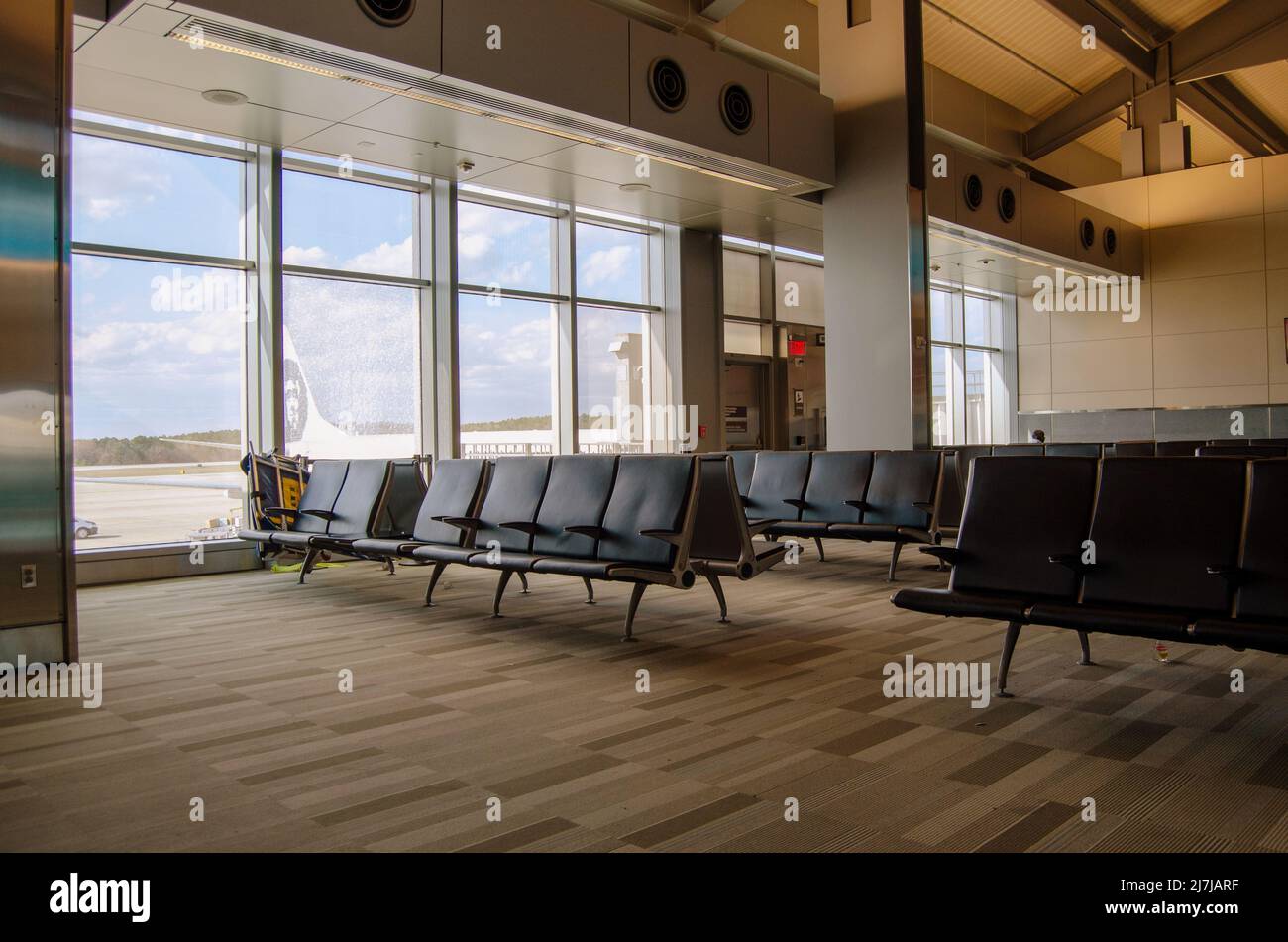 Empty airport seats in the waiting terminal Stock Photo