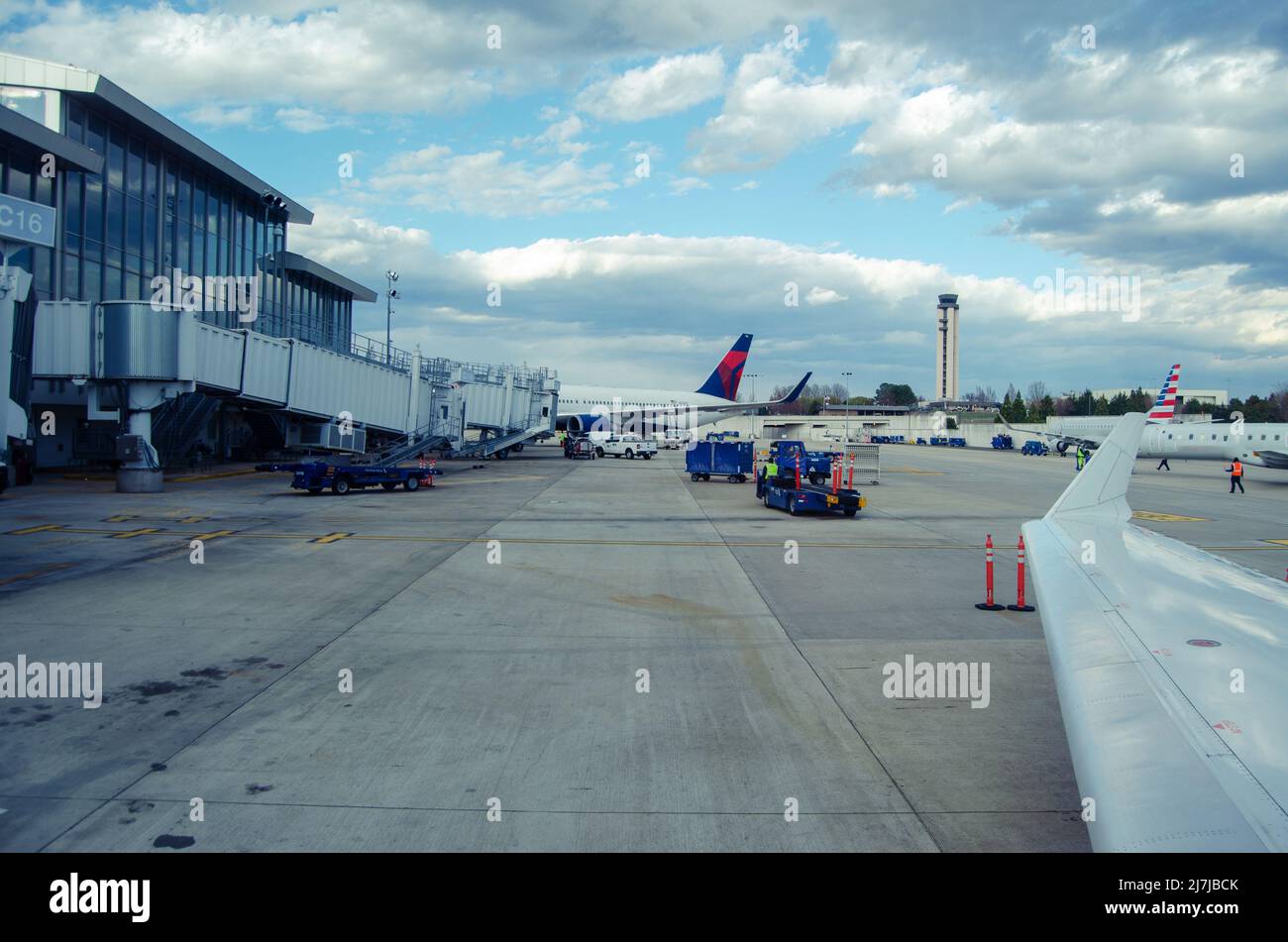 Looking out at the tarmac from the window airport seat. Stock Photo