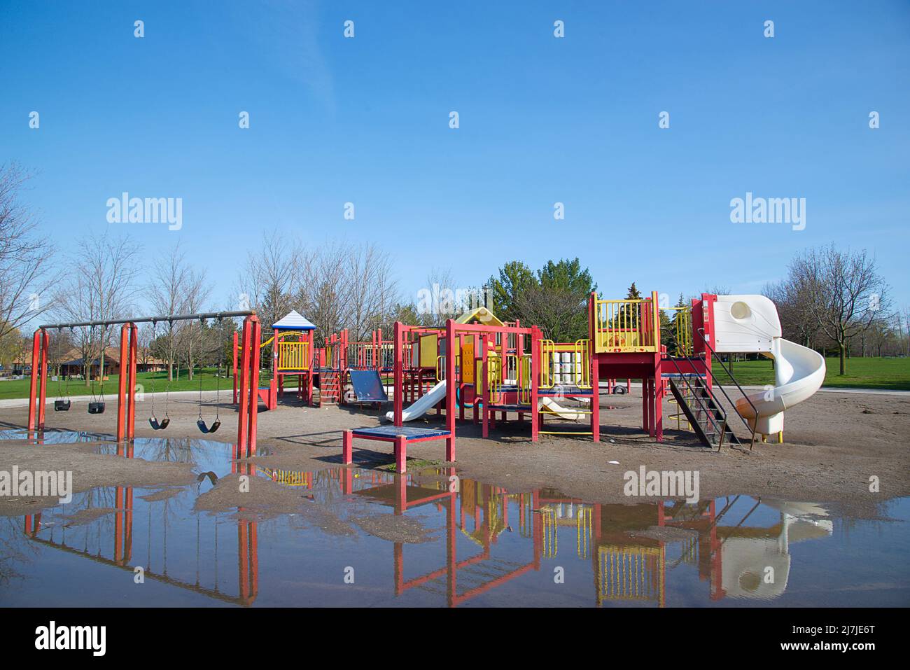 Reflection of the playground at the public park in springtime Stock Photo