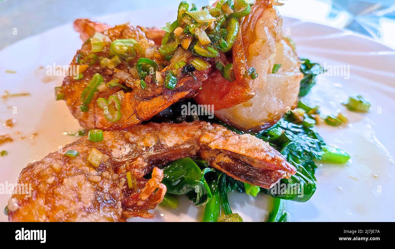 BBQ grilled jumbo shrimp with spicy sauce, Chinese cousin. Stock Photo
