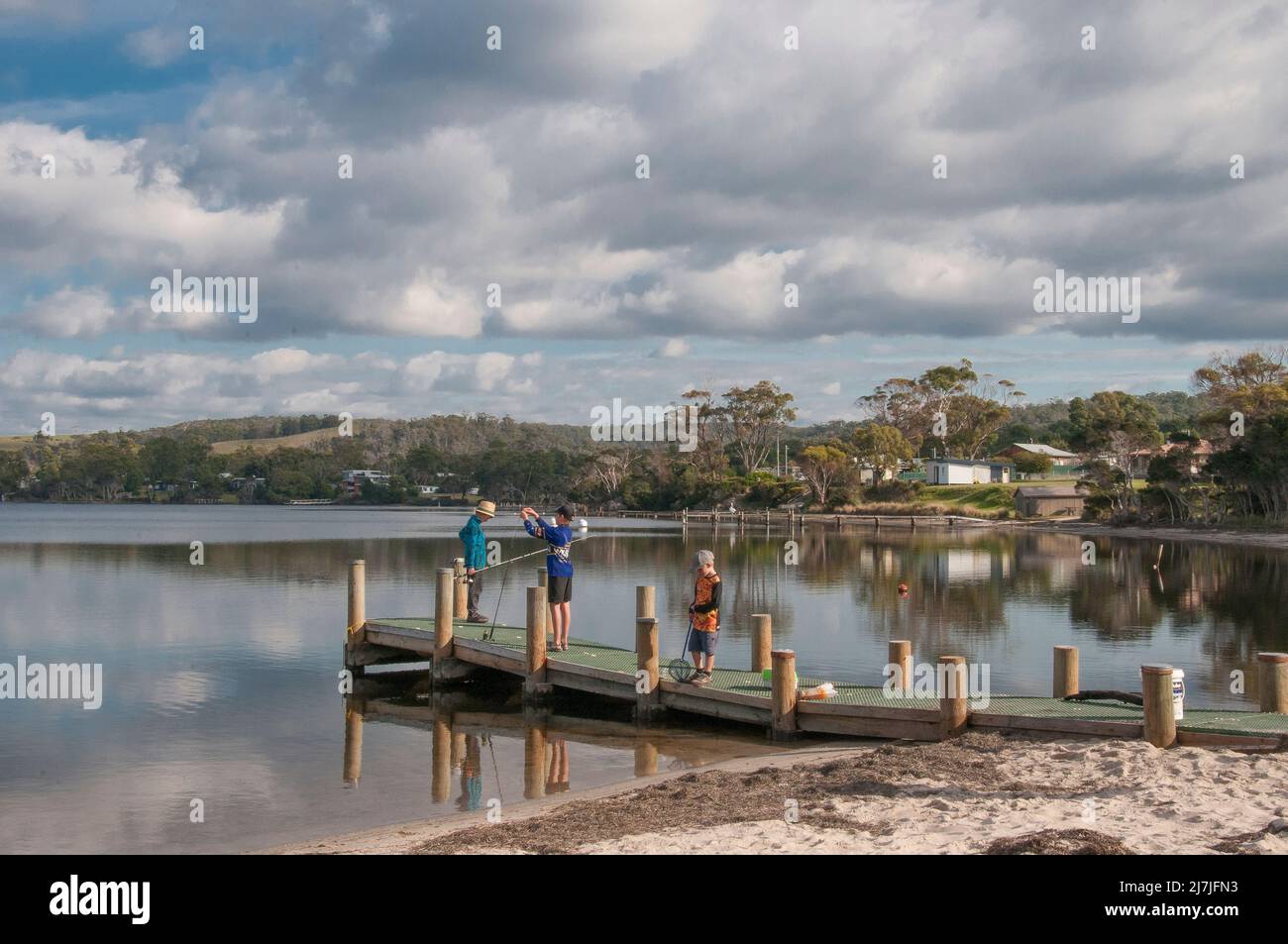 Boys fishing in the lagoon at Ansons Bay, northeastern Tasmania