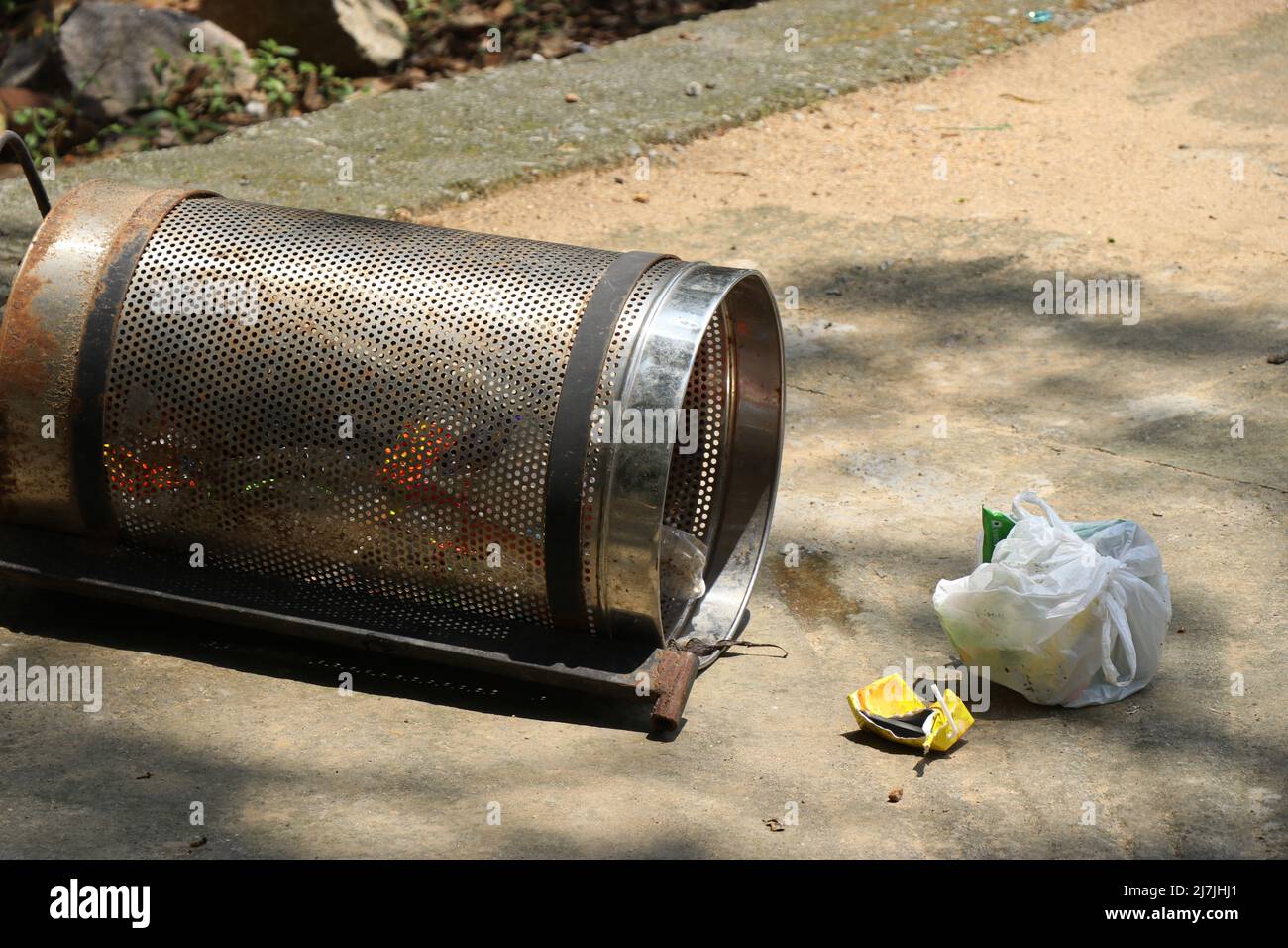Empty metal trash can Stock Photo by magraphics