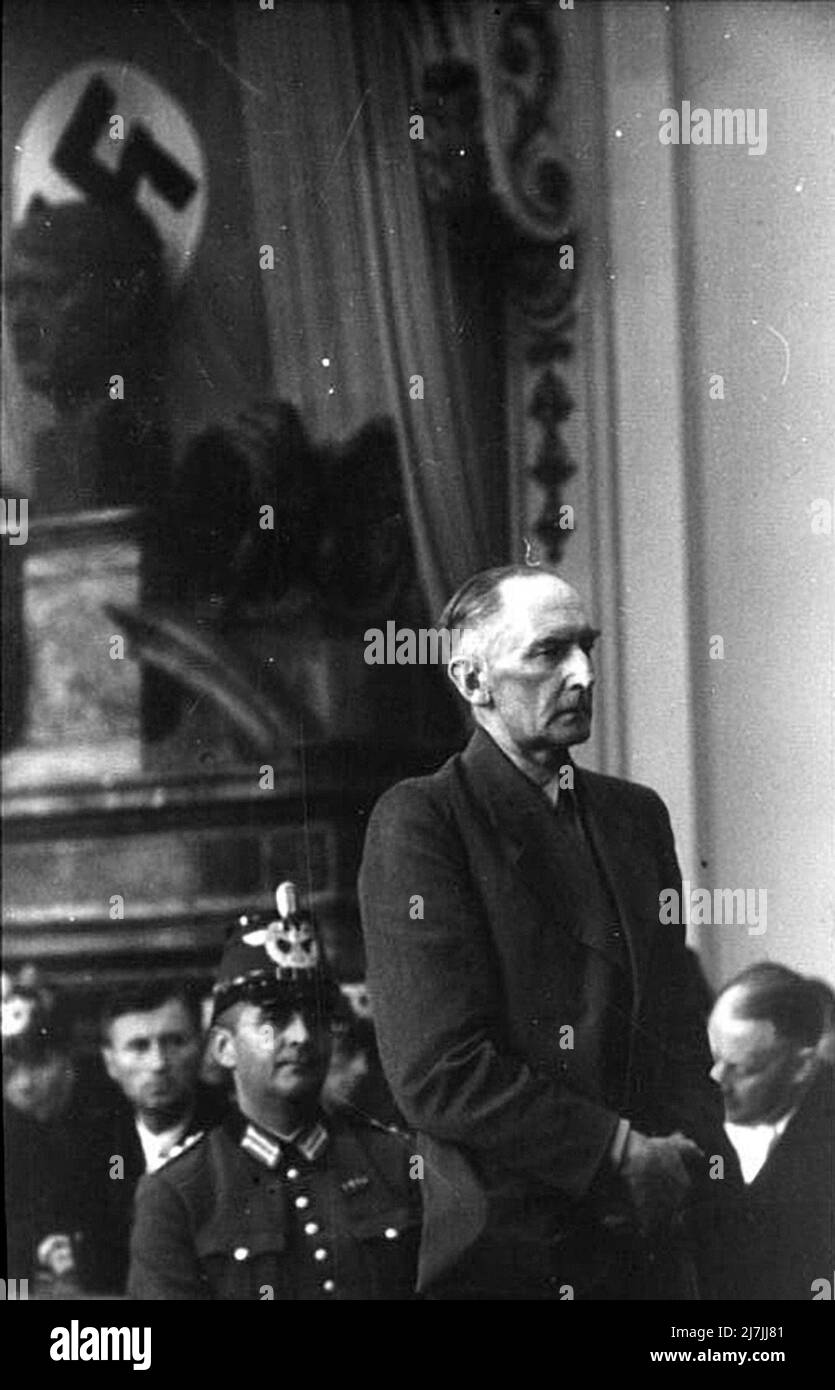 The Wehrmacht Field Marshal Erwin von Fitzleben at his show trial at the People's Court (Volksgerichtshof) for his role in the July 20th 1944 assassination attempt on Hitler. He is gaunt from his treatment by the Gestapo. As an added humiliation they gave him a pair of trousers that were much to large which he had to old up all the time - here he can be seen holding his trousers. He was found guilty and executed the same day in Plötzensee Prison. Stock Photo