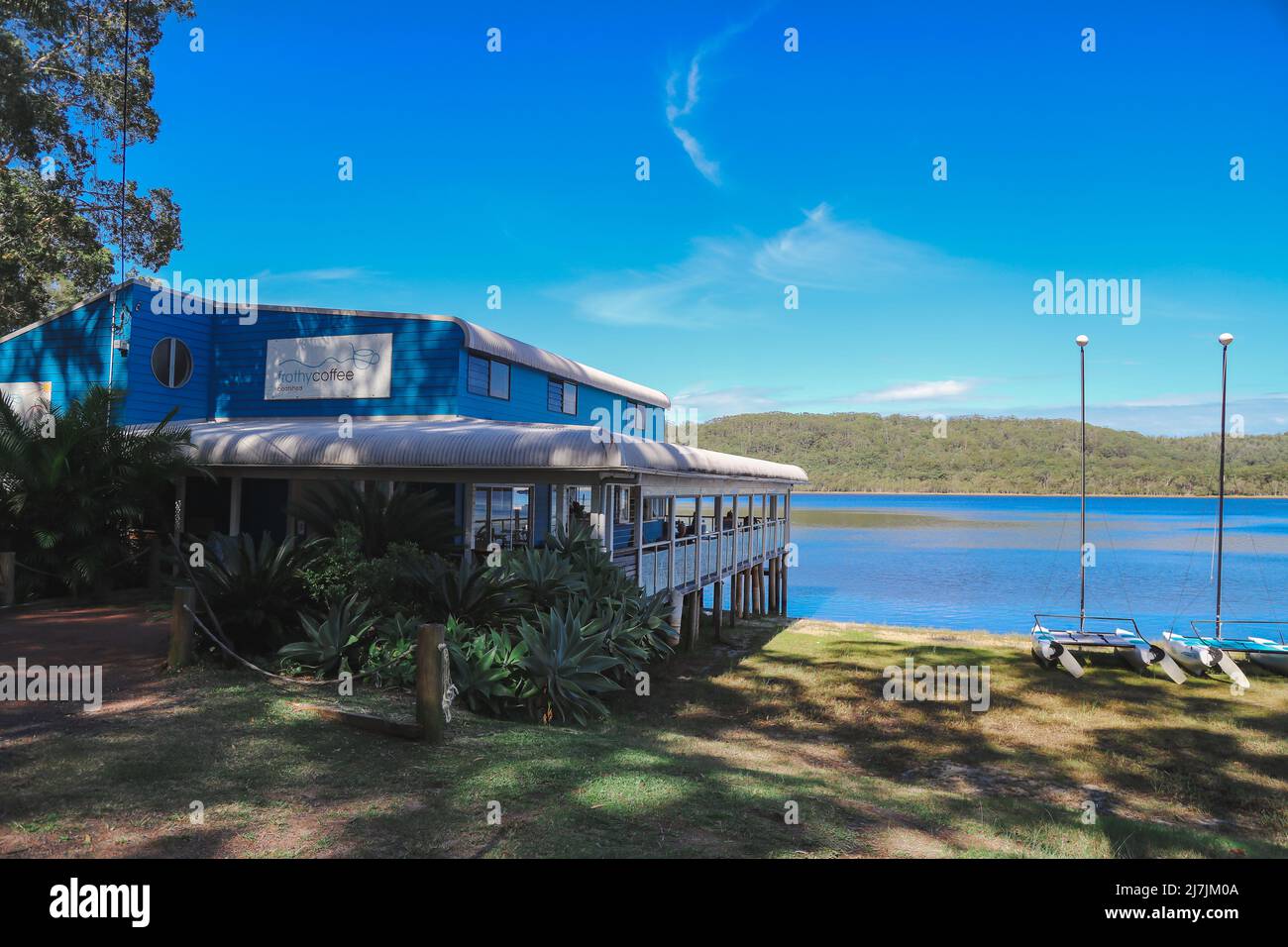 Smith's Lake, NSW Australia - 29 April 2022: Sunny day at the Frothy Coffee Boatshed Cafe Stock Photo