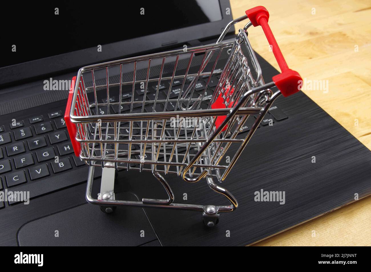 empty shopping cart on a black computer keypad ready for shopping Stock Photo