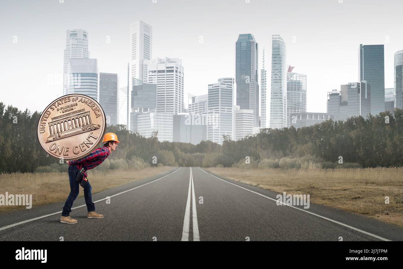 Builder man carry coin Stock Photo Alamy