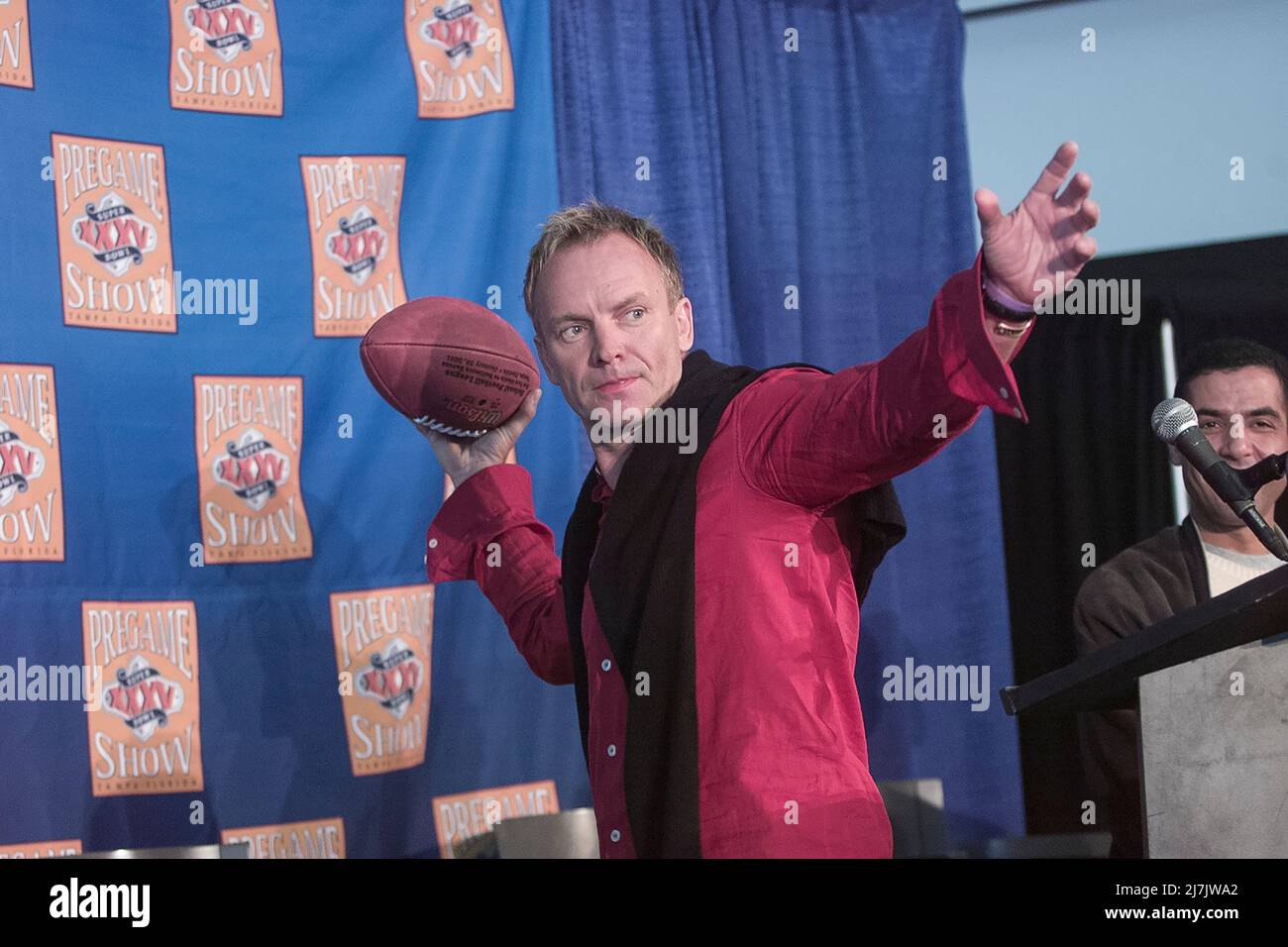 Singer Sting - Gordon Sumner poses with a football during a Super Bowl press Conference on January 26, 2001 in Tampa, FL. Photo credit: Francis Specker Stock Photo