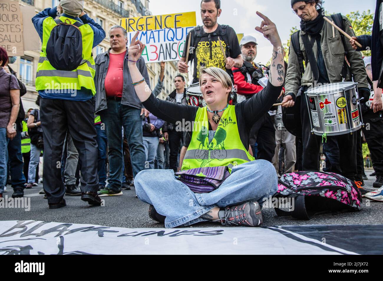 EDITORS NOTE: Image contains profanity)A yellow vest woman is seen  gesturing toward the police during the demonstration against the French  president Emmanuel Macron and the Citizen Initiated Referendum (RIC in  french). Hundreds