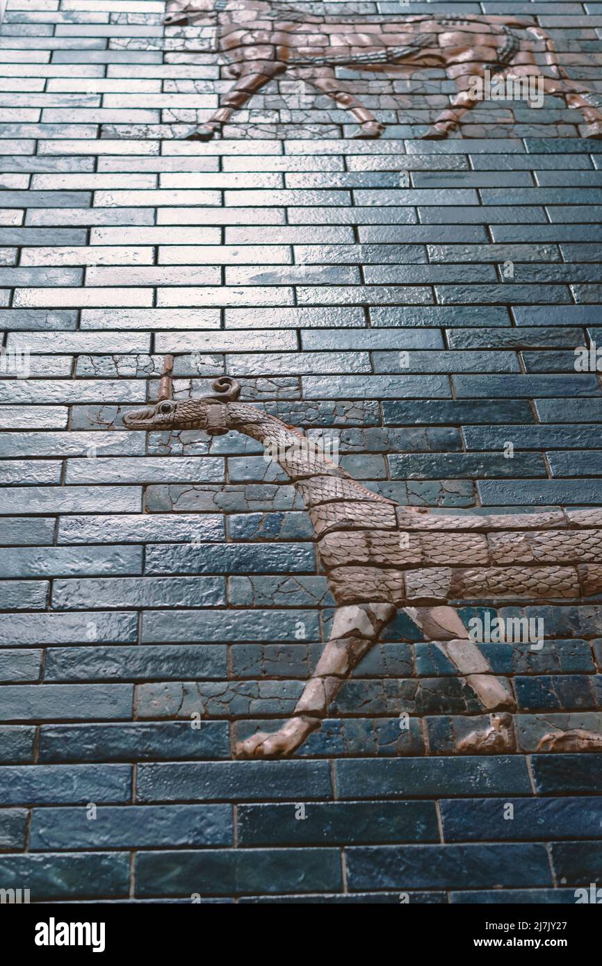 walking deity animals reliefs on glazed ceramic wall from ancient Babylon Stock Photo