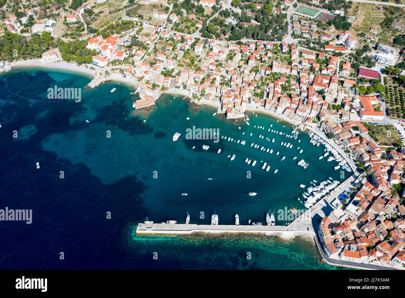 Town and bay of Komiza, Vis Island, Mediterranean Sea, Croatia Stock Photo