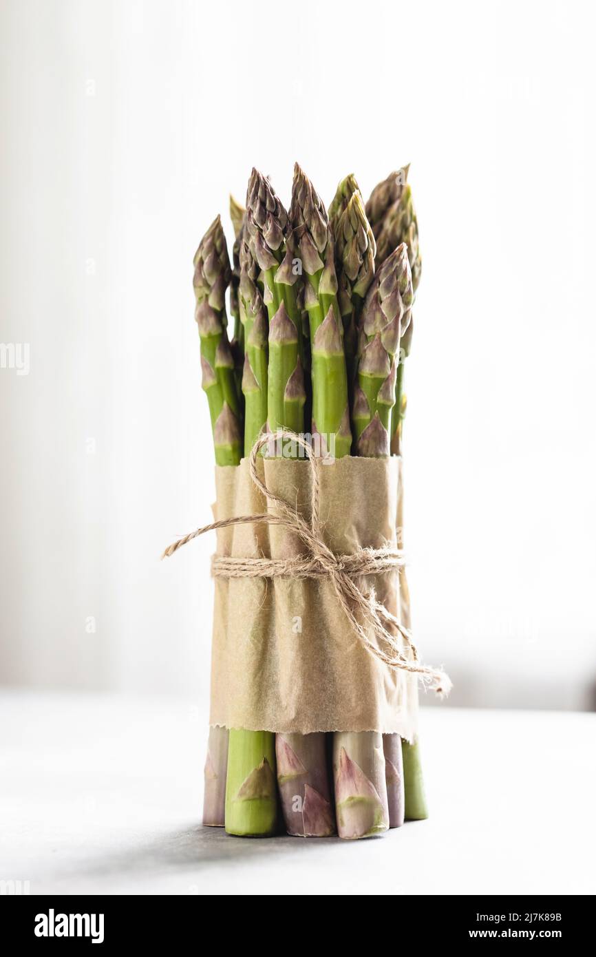 Bunch of fresh asparagus tied rope. Stock Photo