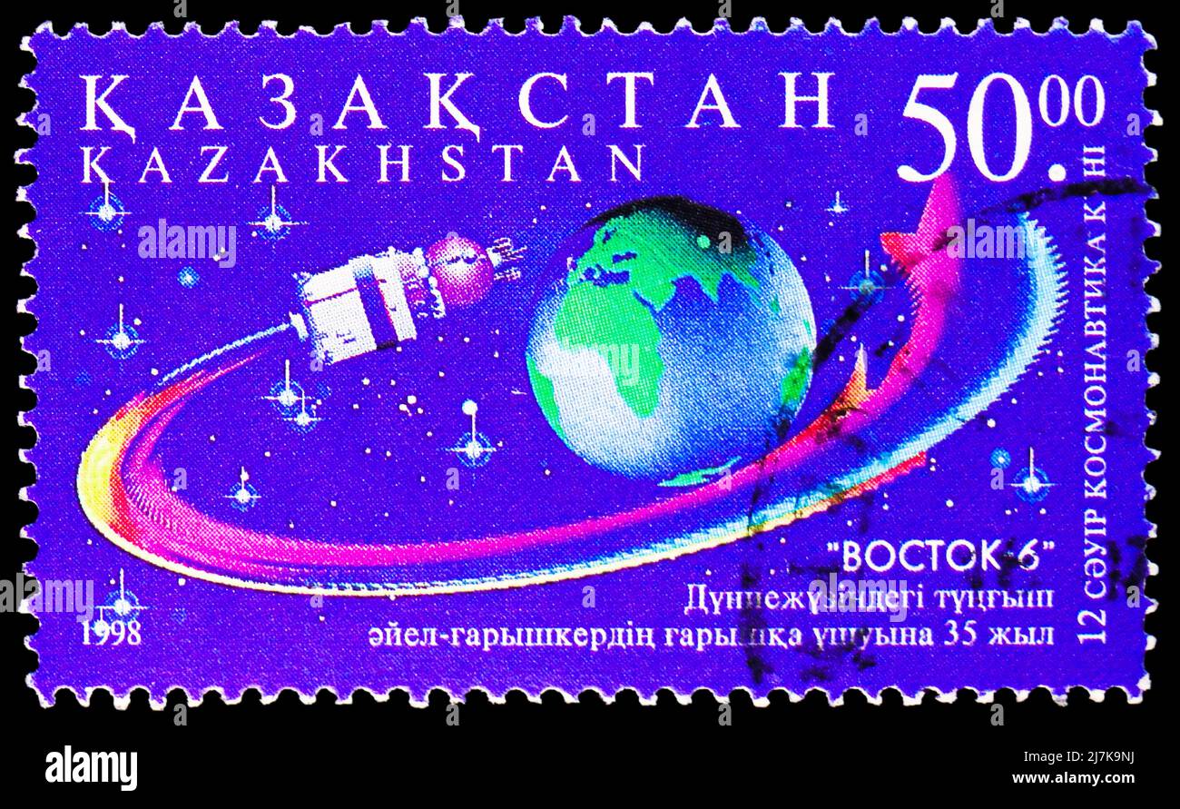 MOSCOW, RUSSIA - MARCH 27, 2022: Postage stamp printed in Kazakhstan shows 'Vostok 6' orbiting Earth, Cosmonautics Day serie, circa 1998 Stock Photo