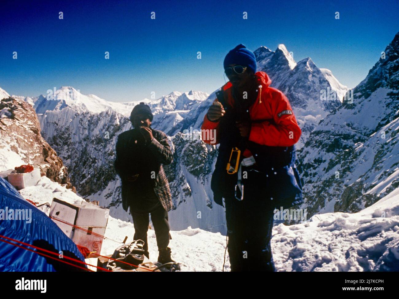 Pakistan Mountaineering On K2 Karakoram Range Tents And Mountaineers eating Stock Photo