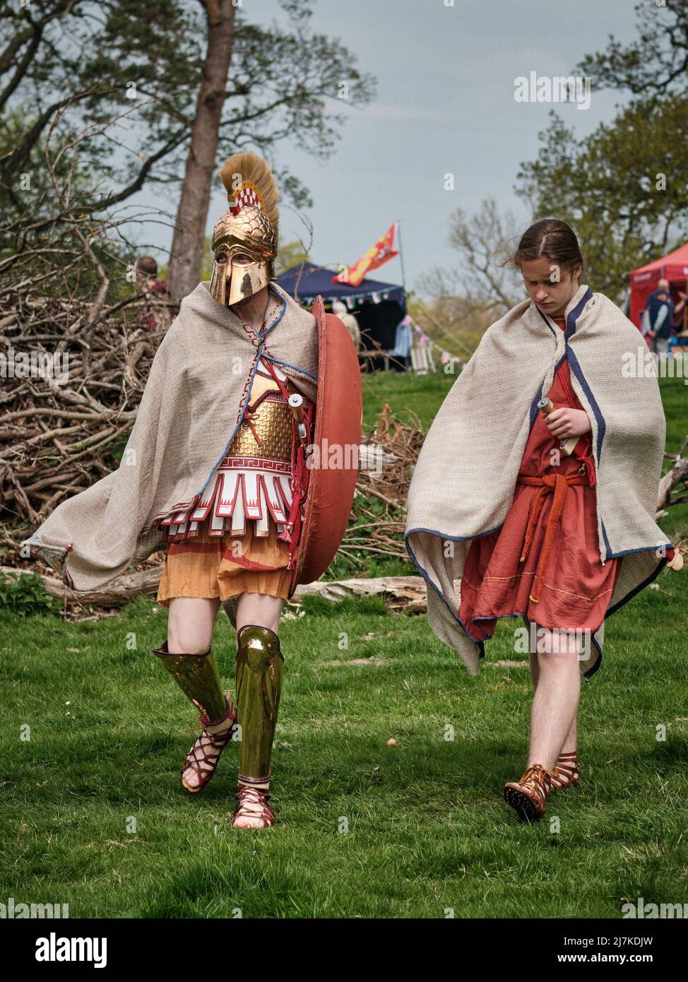 An Ancient Greek warrior walks with a female companion at the No Man's Land Event at Bodrhyddan Hall, Wales Stock Photo