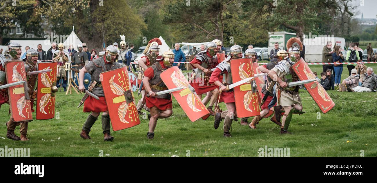 A Roman officer of the Legion VIII leads the charge in the arena at the No Man's Land Event at Bodrhyddan Hall, Wales Stock Photo