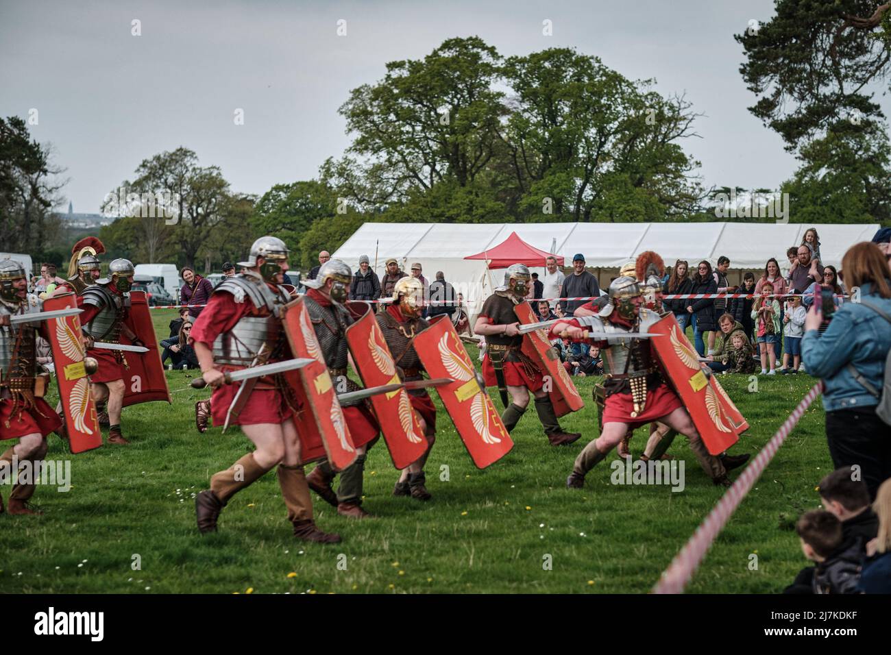Roman legionaries of the Legion VIII charge spectators in the arena at the No Man's Land Event at Bodrhyddan Hall, Wales Stock Photo