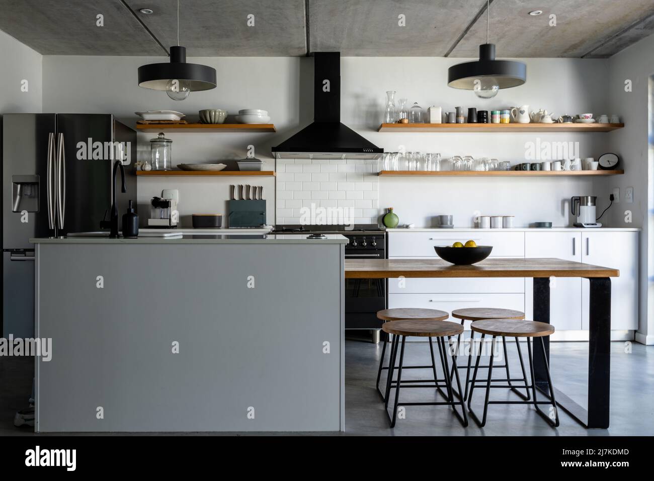 Interior of modern kitchen with appliances, utensils and kitchen island Stock Photo