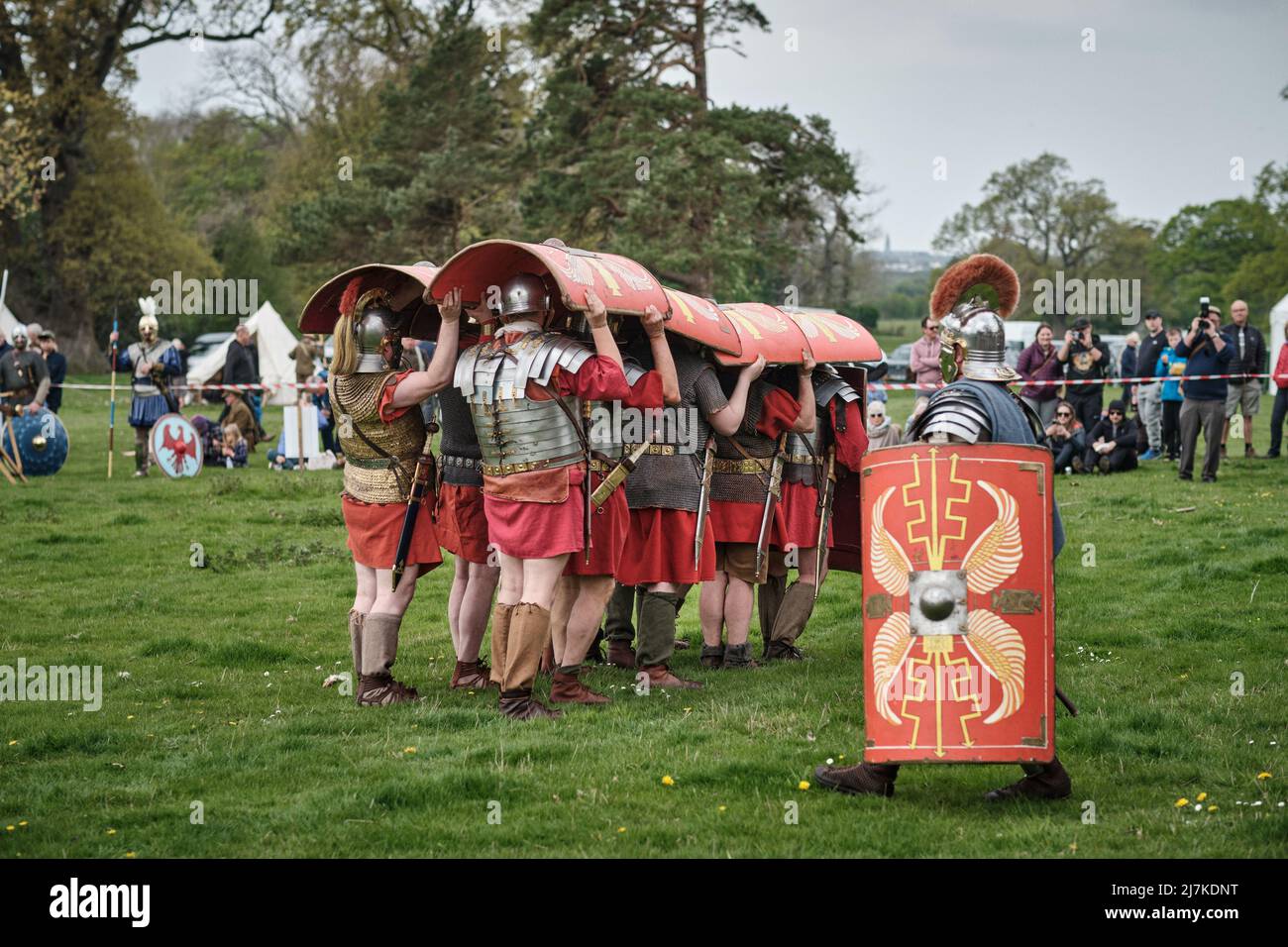 Roman legionaries of the Legion VIII demonstrate the testudo formation in the arena at the No Man's Land Event at Bodrhyddan Hall, Wales Stock Photo
