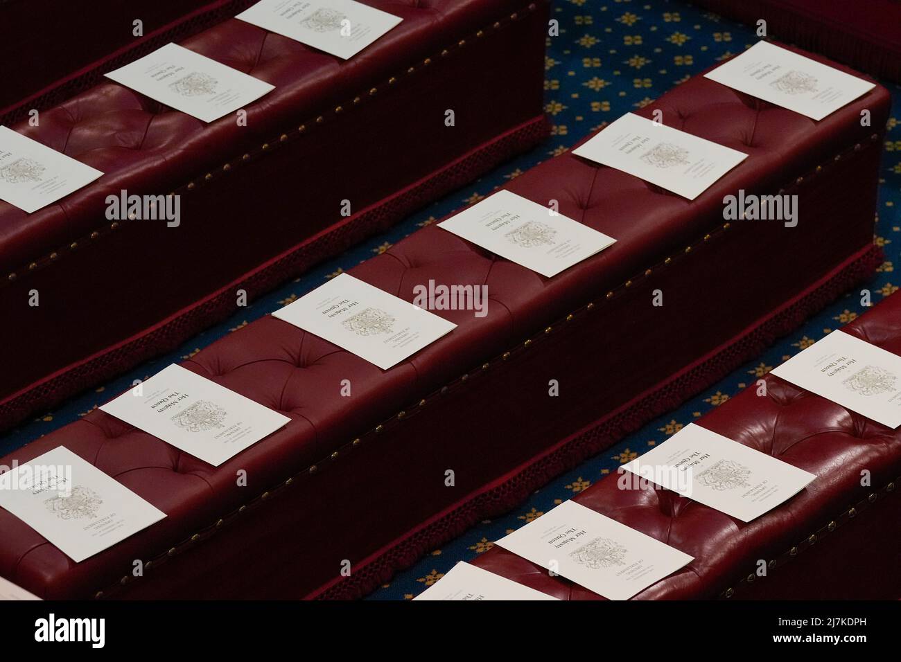 Programs sit on the red benches of the House of Lords ahead of the