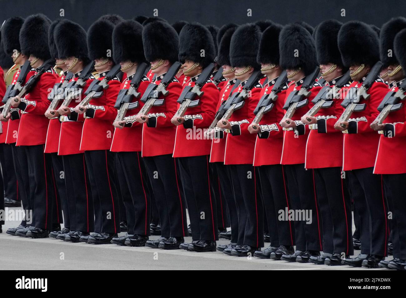The Queen's Guard line up at the Palace of Westminster in London, ahead of the State Opening of Parliament in the House of Lords, London. Picture date: Tuesday May 10, 2022. Stock Photo