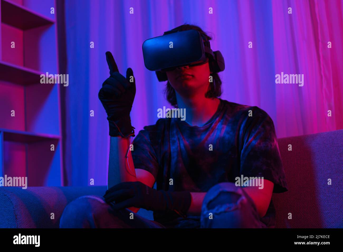 Metaverse technology concept, Man wear VR goggles and glove to making
