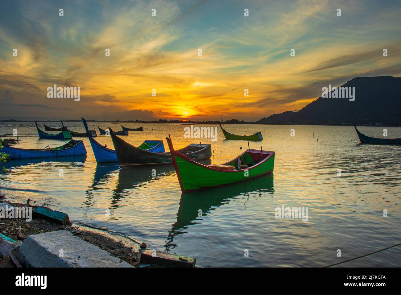 Fishing boat sunrise background Stock Photo