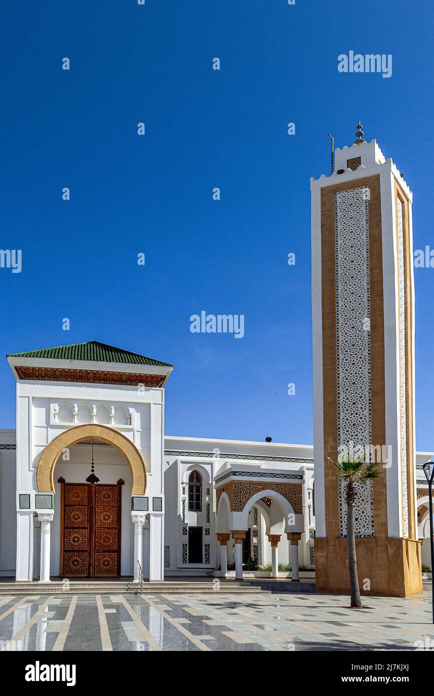 Exterior of historic Muslim mosque with arched passages and closed ...