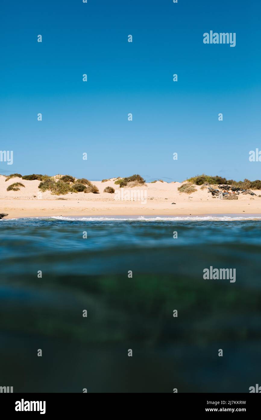 Amazing view of beach in front of sea with turquoise water under blue ...
