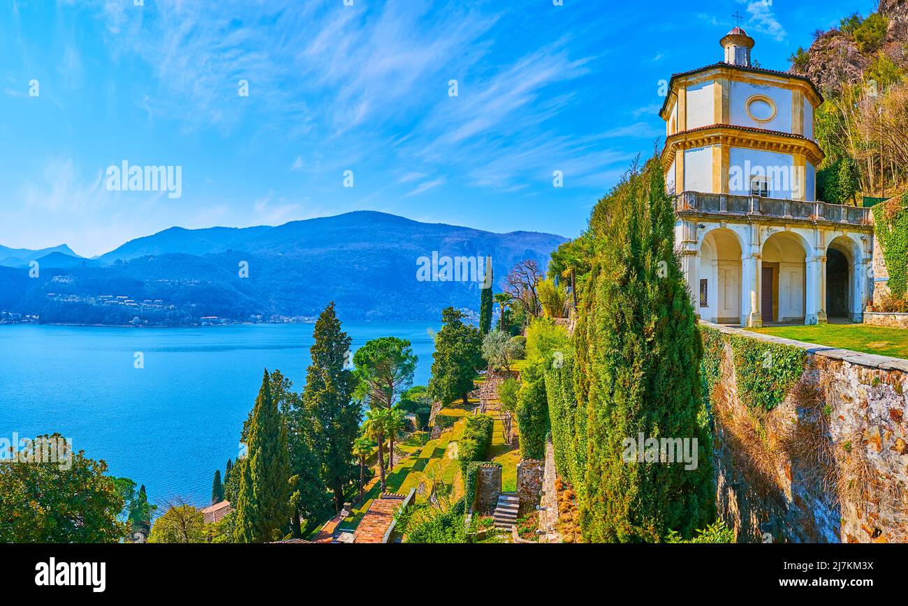 The mountain slope with beautiful terraced Scherrer Park, Oratory of St Anthony of Padua on the top and the scenic azure Lake Lugano at the foot of th Stock Photo
