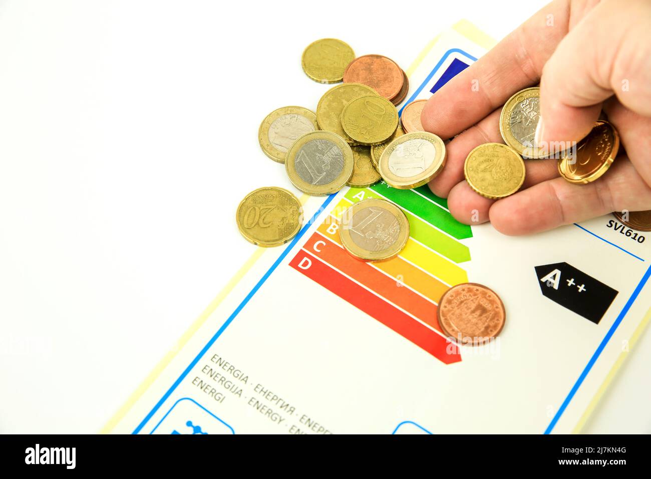 Madrid, Spain- May 9, 2022: European Union Energy Label next hand with coins Stock Photo