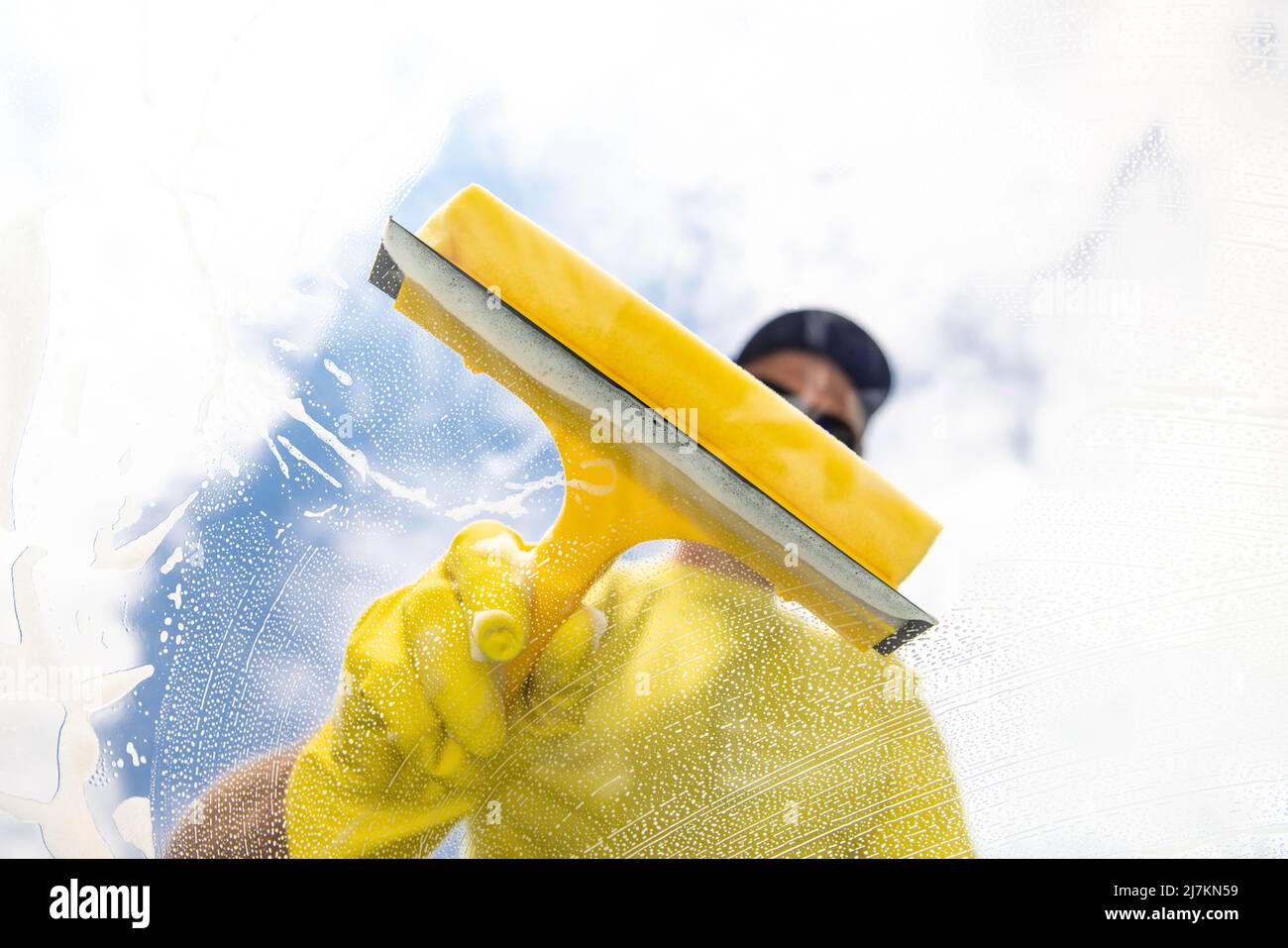 Hand with squeegee hi-res stock photography and images - Alamy