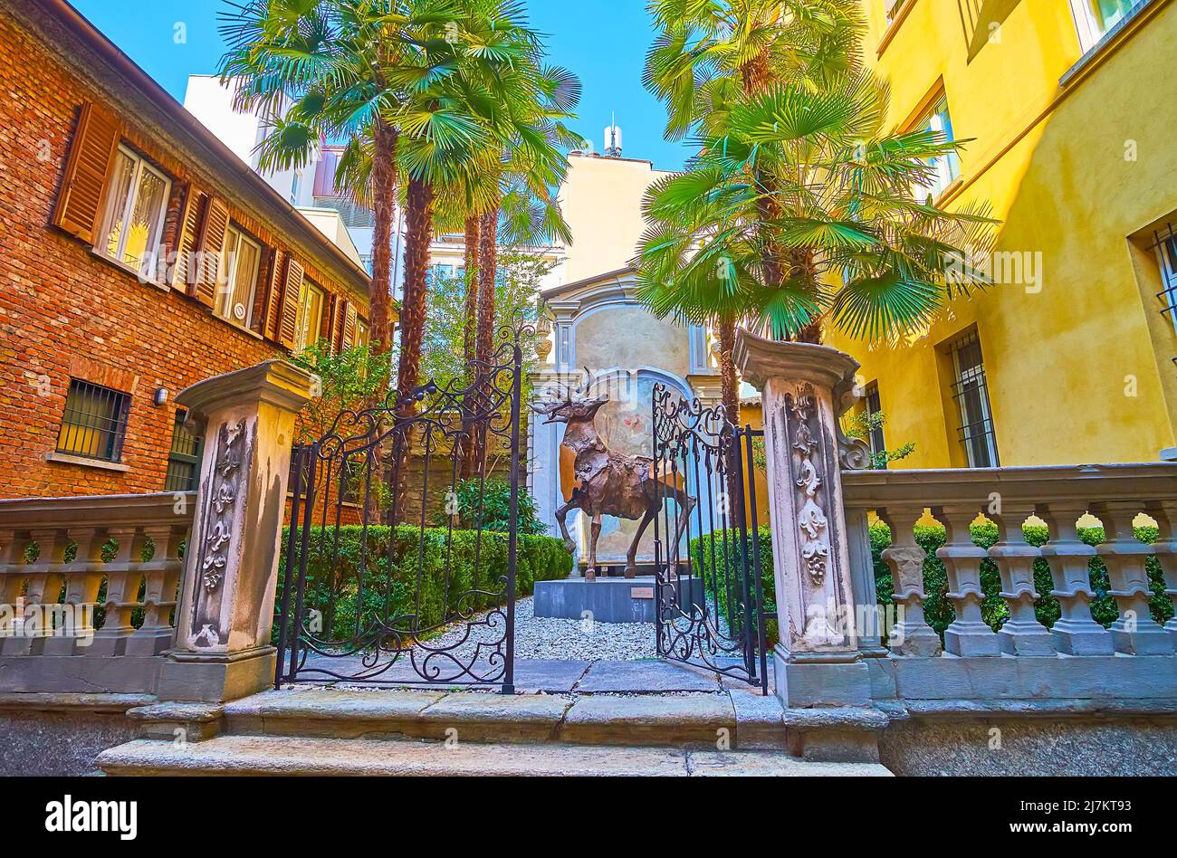 LUGANO, SWITZERLAND - MARCH 25, 2022: The courtyard of Palazzo Riva, decorated with tiny garden and sculpture of deer by Nag Arnoldi, on March 25 in L Stock Photo