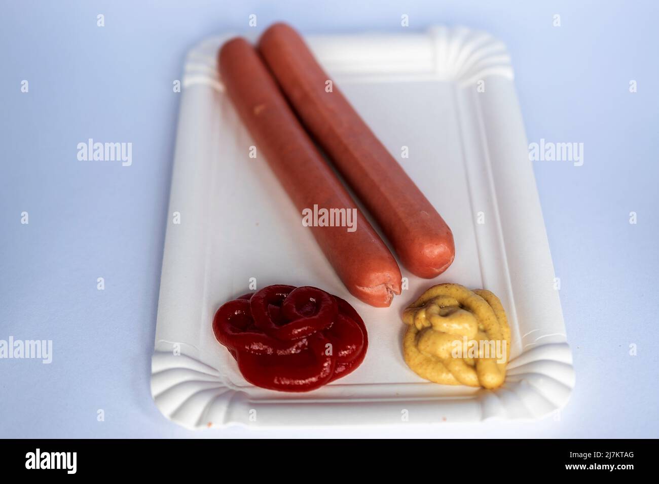 Two sausage in white paper plate Stock Photo