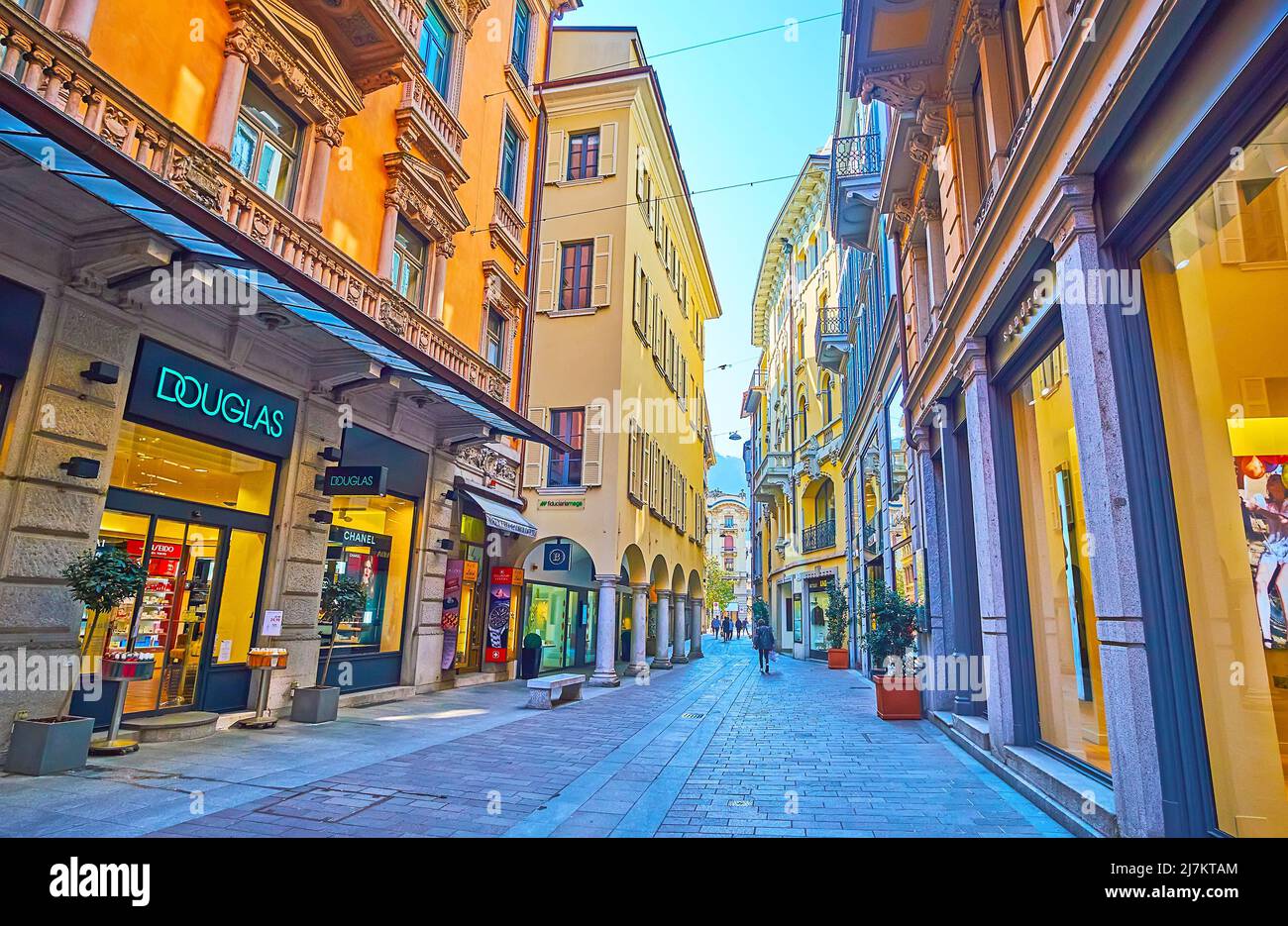 LUGANO, SWITZERLAND - MARCH 25, 2022: The  narrow Via Nassa in the old town with stores and boutiques in historic houses, on March 25 in Lugano Stock Photo