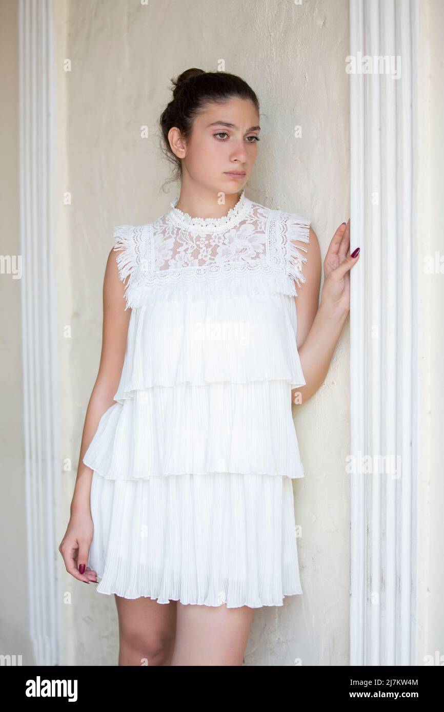 Sad beautiful woman standing indoors Stock Photo