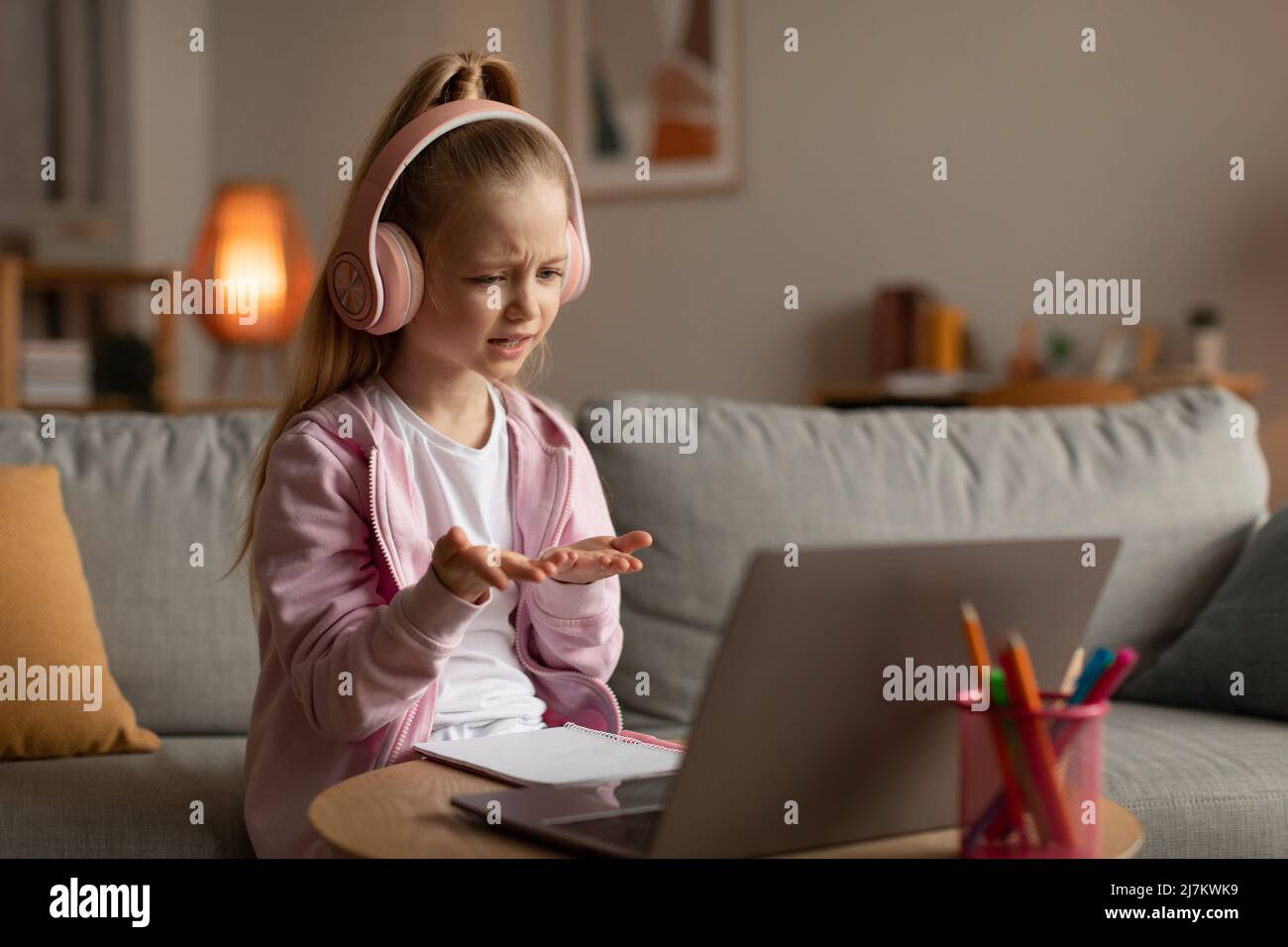 Little Girl Learning Online Using Laptop Video Calling At Home Stock ...