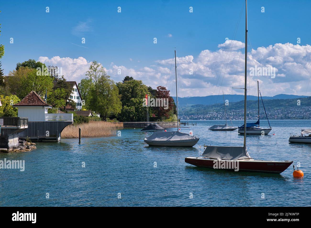 LAKE ZURICH BOATS MOORED AT KUSNACHT Stock Photo
