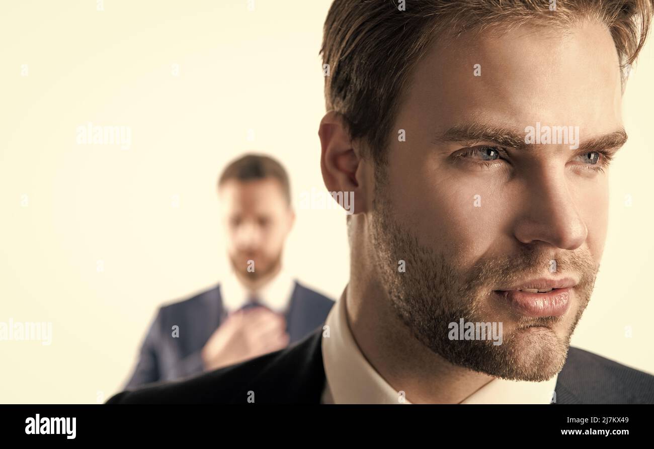 Good-looking person. Serious face of young businessman. Professional man with unshaven face Stock Photo