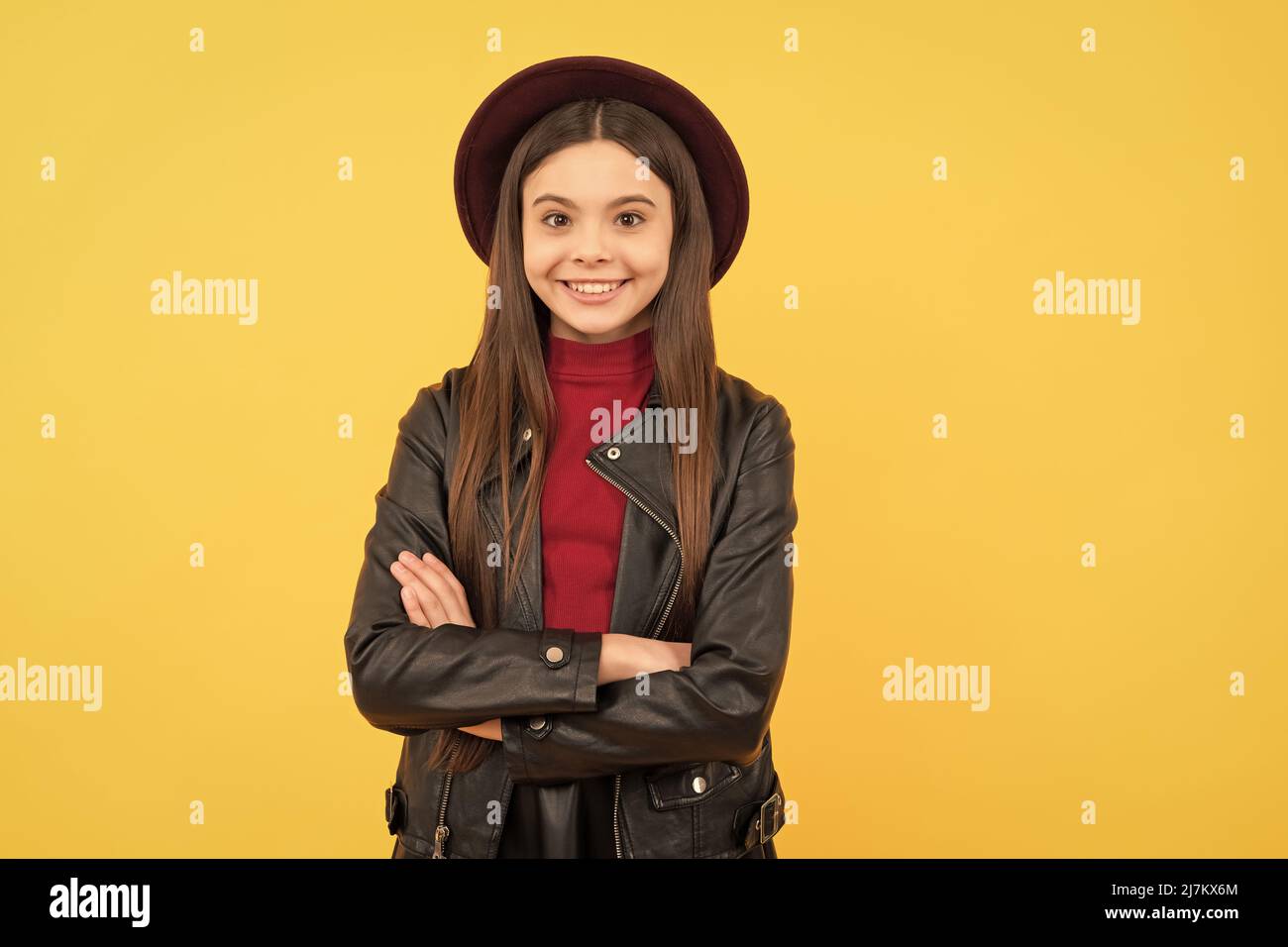 happy teen girl in hat and leather jacket, fashion Stock Photo