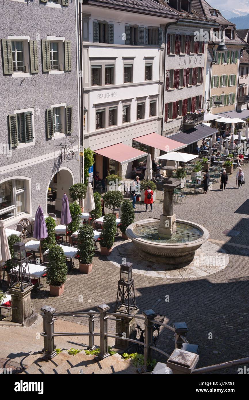 STREET CAFES AND FOUNTAIN IN HAUPTPLATZ, RAPPERSWIL, SWITZERLAND Stock Photo