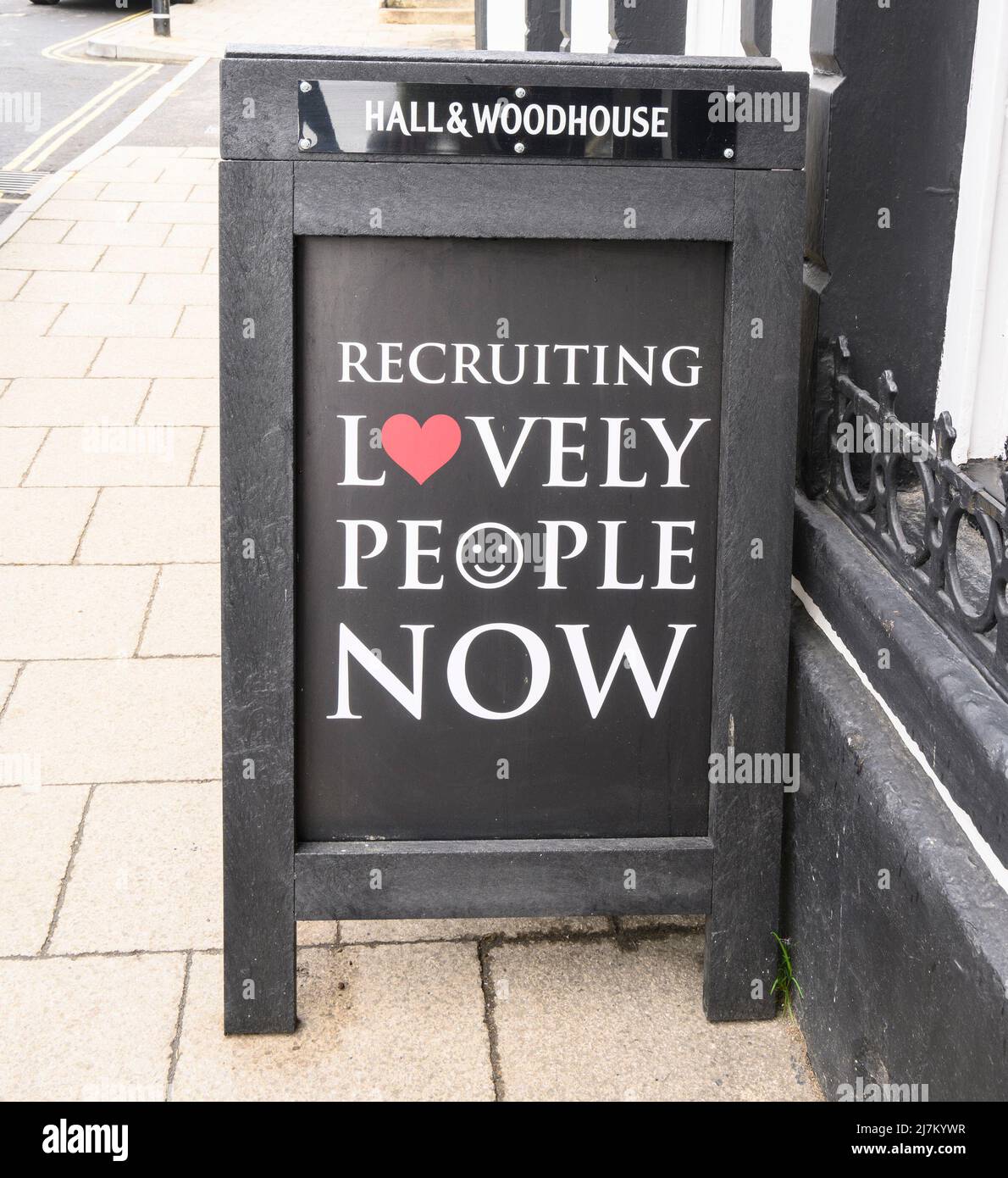 Lyme Regis, Dorset, UK. 10th May 2022. UK News; Cost of Living: Hospitality businesses and small shops in many of England's coastal resorts are struggling to recruit staff for the holiday season. Pictured is an example of the many 'staff wanted' notices currently being displayed in the windows of local business in the small seaside town of Lyme Regis, Dorset. It is has been speculated locally that the high cost of housing in the town, poor public transport links, and the recent prohibitive hikes in the cost of parking may be factors contributing to the staff shortage. Credit: Celia McMahon/ Stock Photo