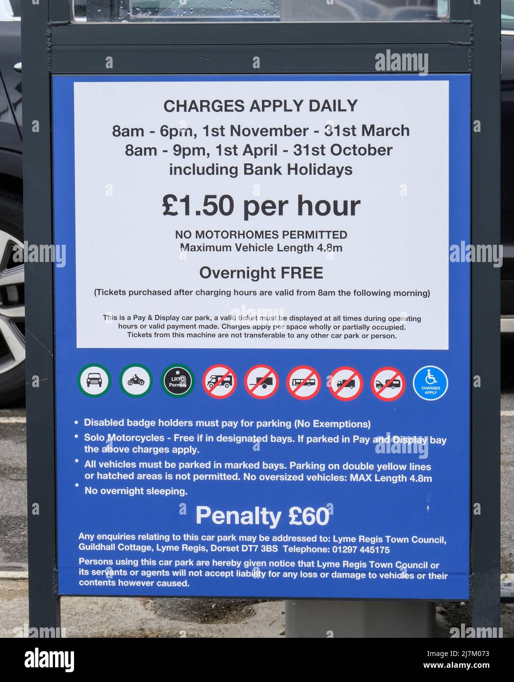 Lyme Regis, Dorset, UK. 10th May, 2022. UK News; Cost of Living: Hospitality businesses and small shops in many of England's coastal resorts are struggling to recruit staff for the holiday season. Pictured is a notice detailing car park charges at Monmouth Beach Carpark. It is has been speculated locally that the high cost of housing in the town, poor public transport links, and the recent prohibitive hikes in the cost of parking may be factors contributing to the staff shortage. Credit: Celia McMahon/Alamy Live News Stock Photo