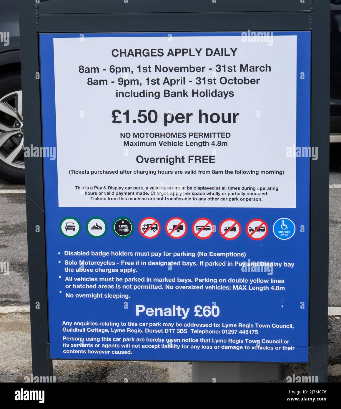 Lyme Regis, Dorset, UK. 10th May, 2022. UK News; Cost of Living: Hospitality businesses and small shops in many of England's coastal resorts are struggling to recruit staff for the holiday season. Pictured is a notice detailing car park charges at Monmouth Beach Carpark. It is has been speculated locally that the high cost of housing in the town, poor public transport links, and the recent prohibitive hikes in the cost of parking may be factors contributing to the staff shortage. Credit: Celia McMahon/Alamy Live News Stock Photo