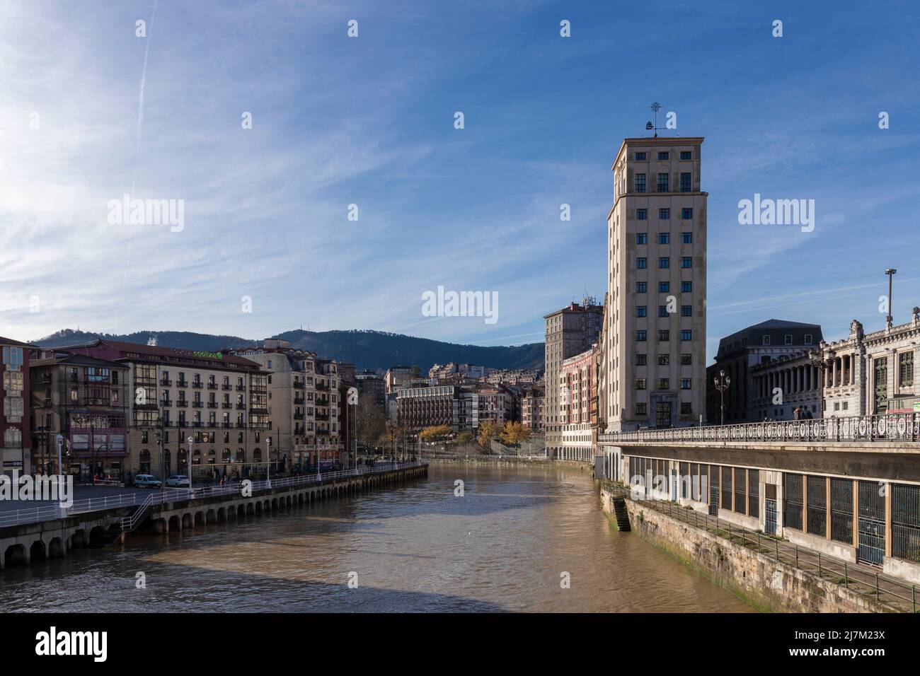 apartment building in the city of bilbao next to the river Stock Photo