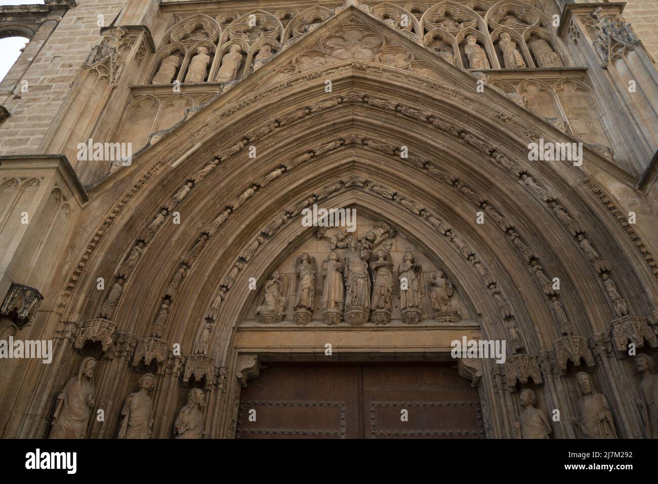 Valencia Spain historic gothic cathedral church external bas relief sculpture Stock Photo